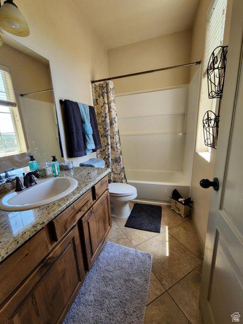 779 S 1850 W, Cedar City, UT 84720 - bathroom with vanity, toilet, tile patterned flooring, and shower / bath combo