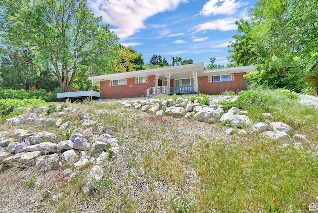 4825 S Burch Creek Dr E, South Ogden, UT 84403 - ranch-style home featuring brick siding and covered porch