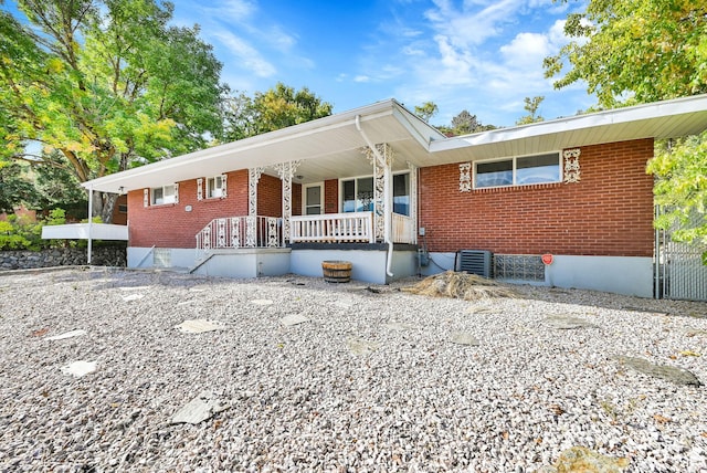 4825 S Burch Creek Dr E, South Ogden, UT 84403 - single story home featuring a porch, brick siding, and central AC