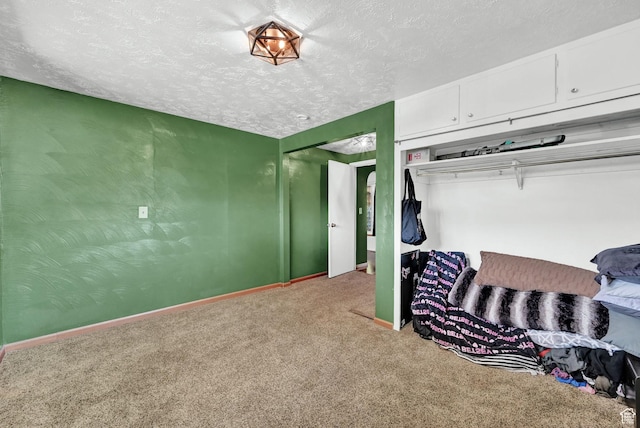 4825 S Burch Creek Dr E, South Ogden, UT 84403 - bedroom with carpet, a textured ceiling, baseboards, and a closet