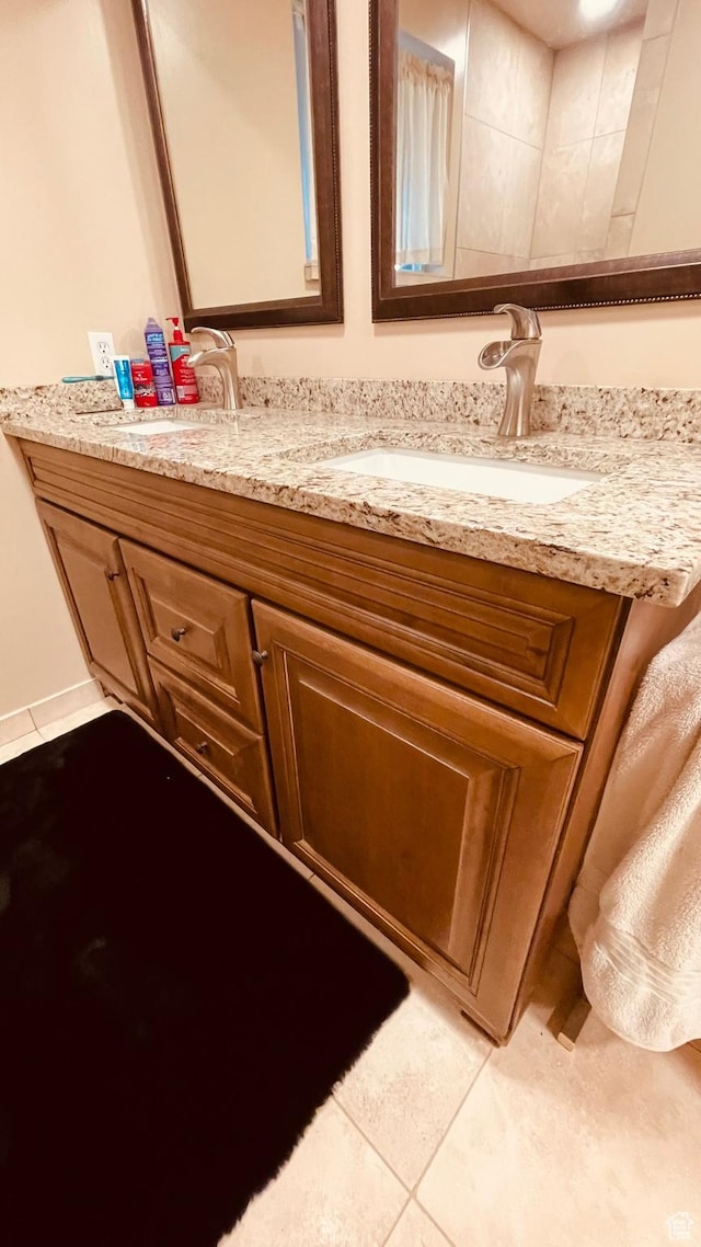 4825 S Burch Creek Dr E, South Ogden, UT 84403 - bathroom with double vanity and tile patterned flooring