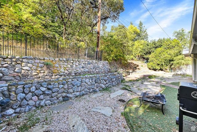4825 S Burch Creek Dr E, South Ogden, UT 84403 - view of yard featuring an outdoor fire pit