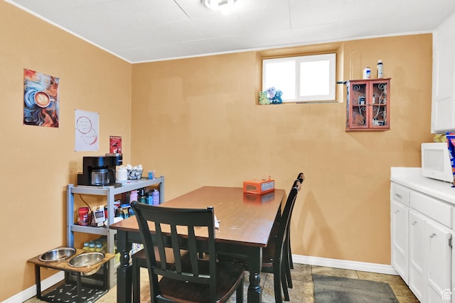 4825 S Burch Creek Dr E, South Ogden, UT 84403 - dining area featuring baseboards and ornamental molding