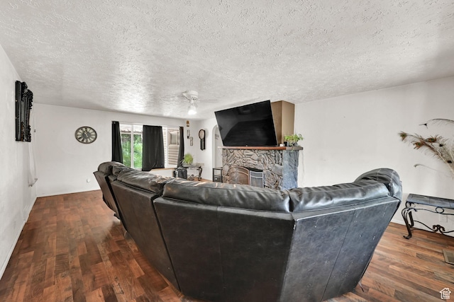 4825 S Burch Creek Dr E, South Ogden, UT 84403 - living room featuring a textured ceiling, wood finished floors, and a fireplace
