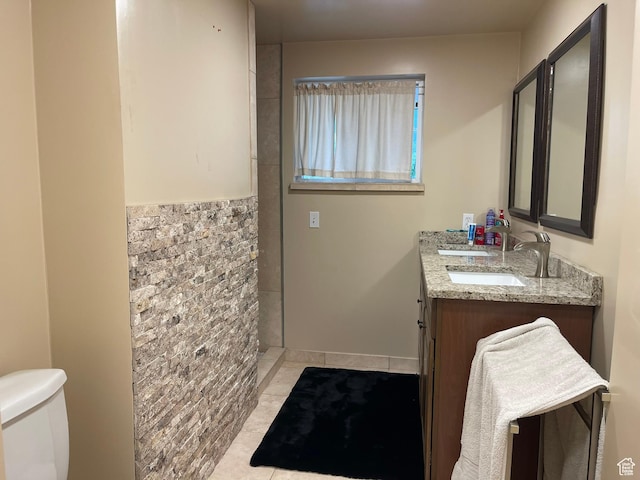 4825 S Burch Creek Dr E, South Ogden, UT 84403 - bathroom featuring tile patterned flooring, double vanity, toilet, and tiled shower