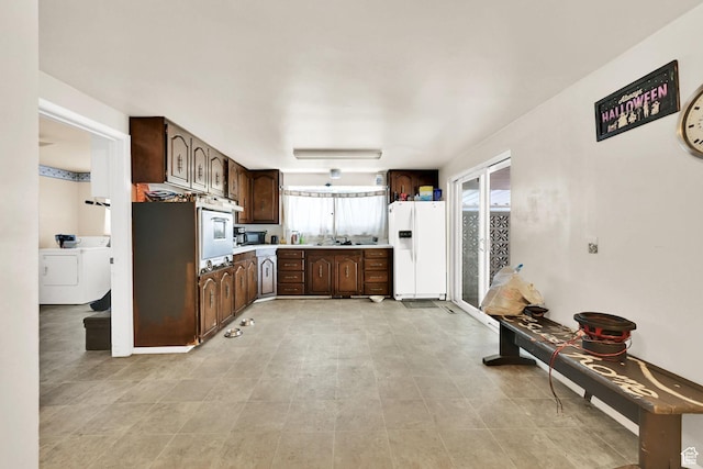 4825 S Burch Creek Dr E, South Ogden, UT 84403 - kitchen with white appliances, washer / dryer, dark brown cabinets, and light countertops