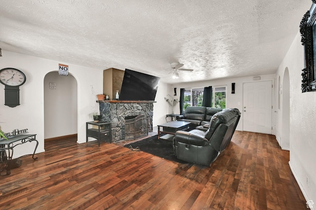 4825 S Burch Creek Dr E, South Ogden, UT 84403 - living room featuring arched walkways, a ceiling fan, a textured ceiling, and wood-type flooring