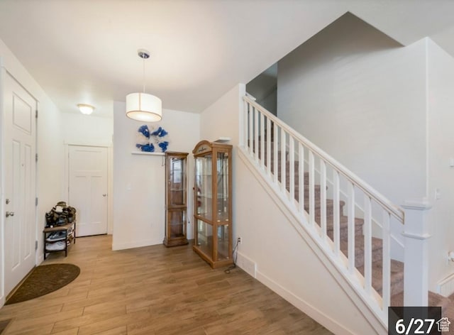 269 W Willow Dr, Saratoga Springs, UT 84045 - stairs featuring wood finished floors, baseboards, and french doors
