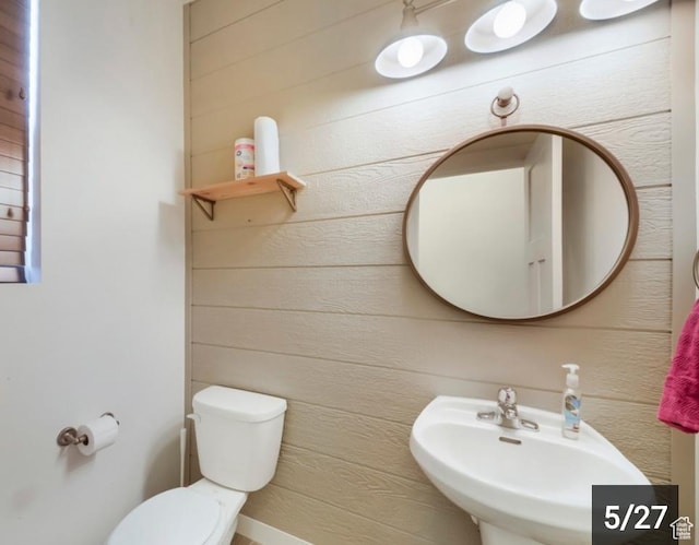 269 W Willow Dr, Saratoga Springs, UT 84045 - half bath with a sink, toilet, and wooden walls