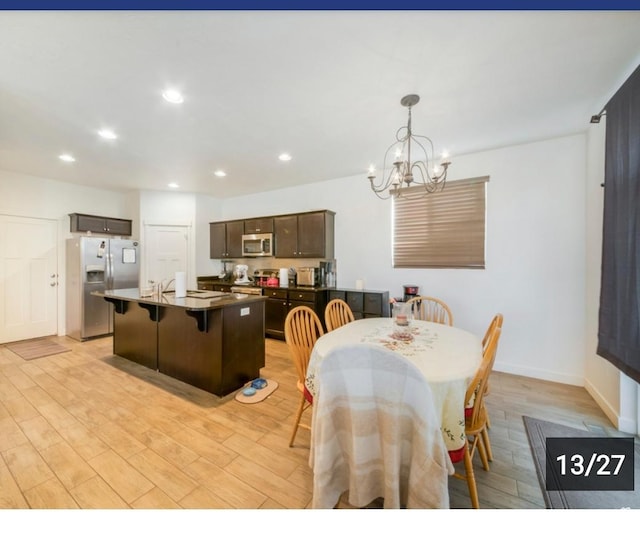 269 W Willow Dr, Saratoga Springs, UT 84045 - dining area featuring light wood-style floors, a chandelier, recessed lighting, and baseboards