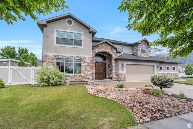 758 W 375 N, Springville, UT 84663 - view of front of house with stone siding, stucco siding, a gate, and concrete driveway