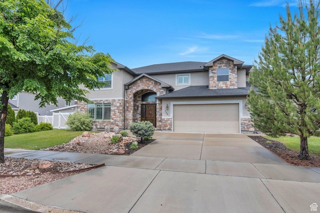 758 W 375 N, Springville, UT 84663 - view of front of home featuring stucco siding, stone siding, driveway, and a garage