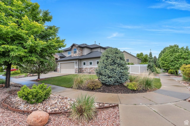 758 W 375 N, Springville, UT 84663 - view of front of property featuring stone siding, concrete driveway, a garage, and stucco siding