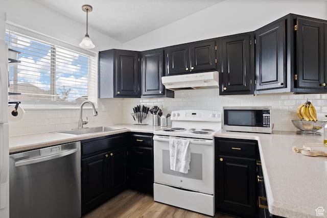 429 S Storrs Ave, American Fork, UT 84003 - kitchen featuring appliances with stainless steel finishes, under cabinet range hood, a sink, lofted ceiling, and light countertops