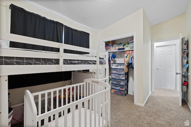 429 S Storrs Ave, American Fork, UT 84003 - bedroom featuring carpet floors, a closet, baseboards, lofted ceiling, and a textured ceiling