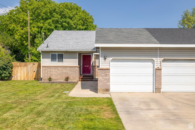 429 S Storrs Ave, American Fork, UT 84003 - view of front of home featuring a garage, entry steps, concrete driveway, brick siding, and roof with shingles