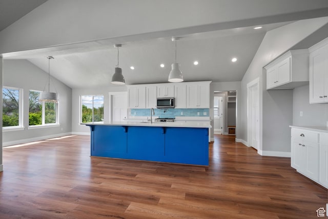 1047 N 700 W, Mapleton, UT 84664 - kitchen featuring stainless steel microwave, light countertops, white cabinets, recessed lighting, and baseboards