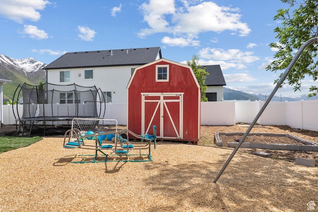 1047 N 700 W, Mapleton, UT 84664 - view of shed with a trampoline, a fenced backyard, and a mountain view