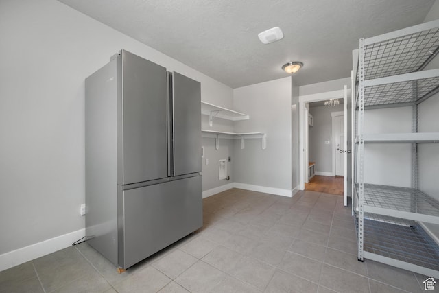 1047 N 700 W, Mapleton, UT 84664 - kitchen with freestanding refrigerator, baseboards, light tile patterned flooring, and open shelves