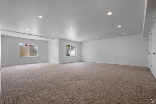 1047 N 700 W, Mapleton, UT 84664 - empty room with light carpet, recessed lighting, baseboards, and a textured ceiling