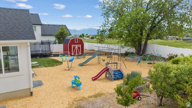 1047 N 700 W, Mapleton, UT 84664 - view of play area with a trampoline, a mountain view, and a fenced backyard