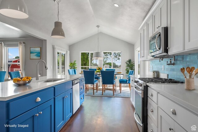 1047 N 700 W, Mapleton, UT 84664 - kitchen featuring stainless steel appliances, a sink, blue cabinets, light countertops, and lofted ceiling