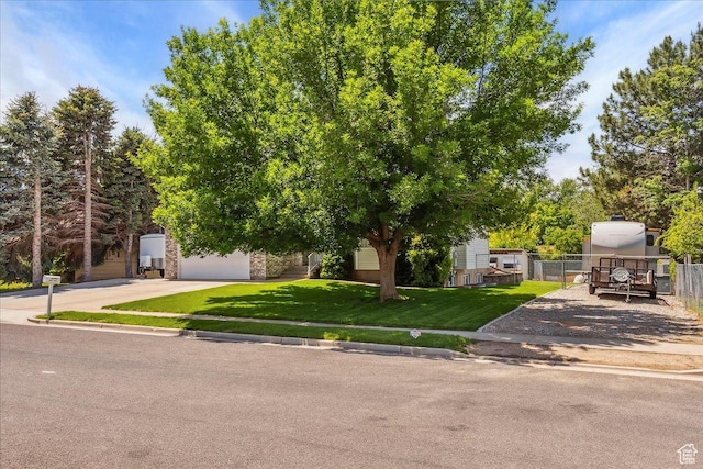 987 N 3150 W, West Point, UT 84015 - view of property hidden behind natural elements with driveway and a garage