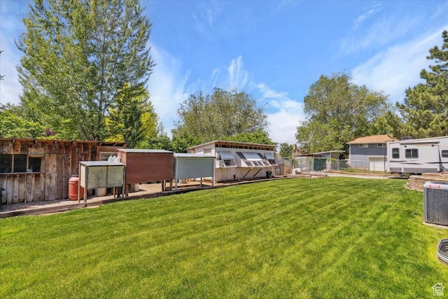 987 N 3150 W, West Point, UT 84015 - view of yard featuring exterior structure, central AC unit, and an outdoor structure
