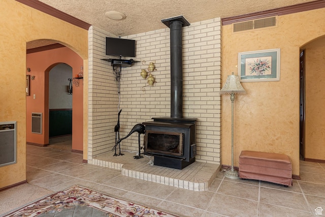 845 S 80 W, Hurricane, UT 84737 - tiled living area with a wood stove, heating unit, arched walkways, and a textured ceiling