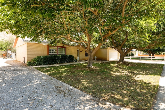 845 S 80 W, Hurricane, UT 84737 - view of front facade featuring brick siding, a garage, and gravel driveway