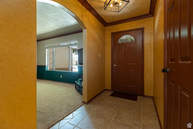 845 S 80 W, Hurricane, UT 84737 - entryway with crown molding, carpet, arched walkways, a textured ceiling, and plenty of natural light