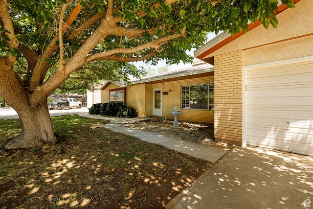 845 S 80 W, Hurricane, UT 84737 - view of side of home with brick siding and an attached garage