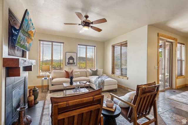 5430 N Cross Country Way, Park City, UT 84098 - living area with baseboards, a fireplace, ceiling fan, and stone tile floors