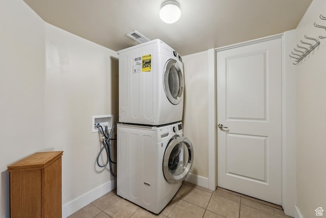 5430 N Cross Country Way, Park City, UT 84098 - laundry room featuring stacked washing machine and dryer, baseboards, and light tile patterned floors