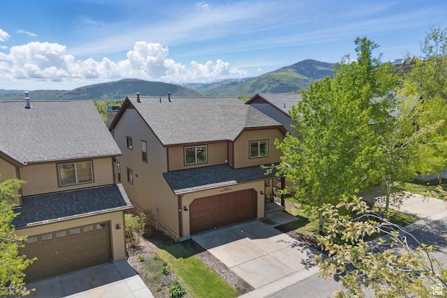 5430 N Cross Country Way, Park City, UT 84098 - craftsman-style home featuring a mountain view, a garage, concrete driveway, and roof with shingles