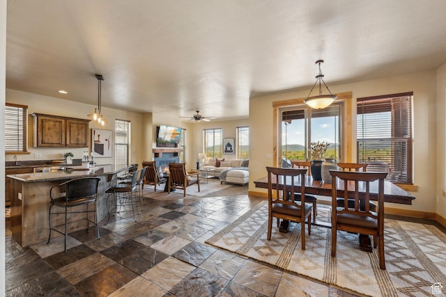 5430 N Cross Country Way, Park City, UT 84098 - dining room with plenty of natural light, baseboards, recessed lighting, ceiling fan, and a lit fireplace