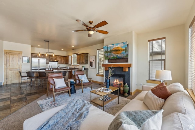 5430 N Cross Country Way, Park City, UT 84098 - living area with ceiling fan, baseboards, and a tiled fireplace