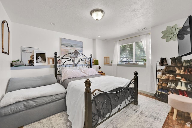 5443 S 4175 W, Roy, UT 84067 - bedroom featuring a textured ceiling and wood finished floors