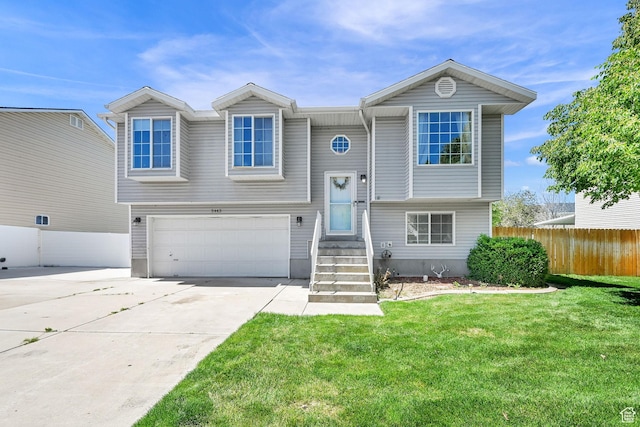 5443 S 4175 W, Roy, UT 84067 - split foyer home with an attached garage and concrete driveway