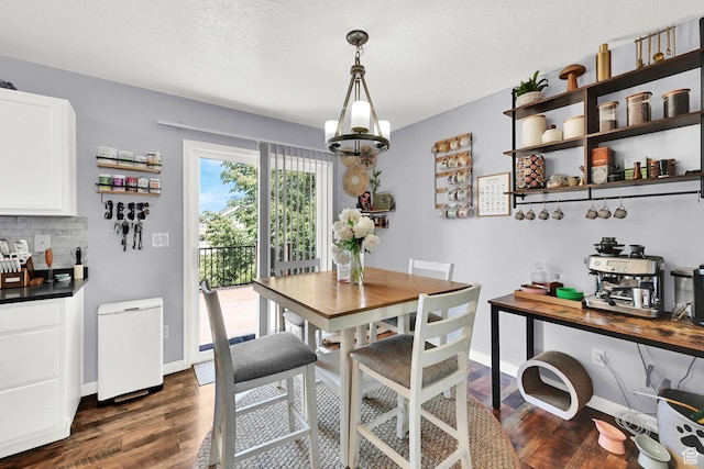 5443 S 4175 W, Roy, UT 84067 - dining area featuring dark wood-style floors and baseboards