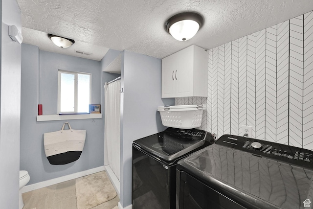 5443 S 4175 W, Roy, UT 84067 - laundry room with washing machine and clothes dryer, a textured ceiling, and baseboards