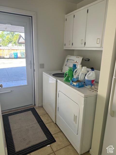 3165 S Green St, Salt Lake City, UT 84106 - laundry room with washer and dryer, light tile patterned flooring, and cabinet space