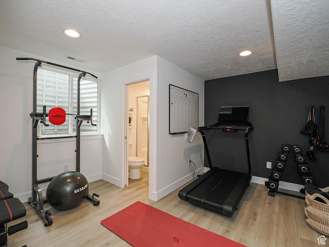 4535 S Bleecker Pl, Millcreek, UT 84117 - workout room with a textured ceiling, wood finished floors, baseboards, and recessed lighting