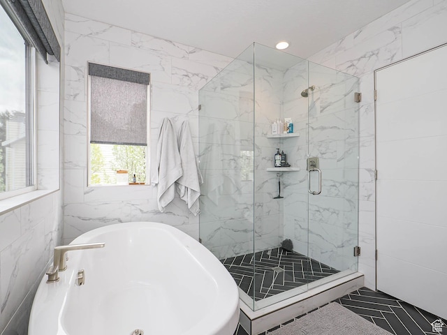 4535 S Bleecker Pl, Millcreek, UT 84117 - full bathroom featuring tile walls, a freestanding tub, a marble finish shower, and recessed lighting