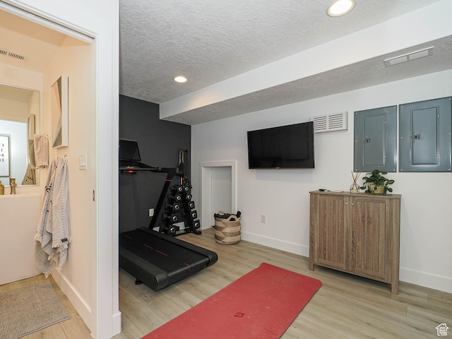 4535 S Bleecker Pl, Millcreek, UT 84117 - exercise area with baseboards, wood finished floors, electric panel, recessed lighting, and a textured ceiling