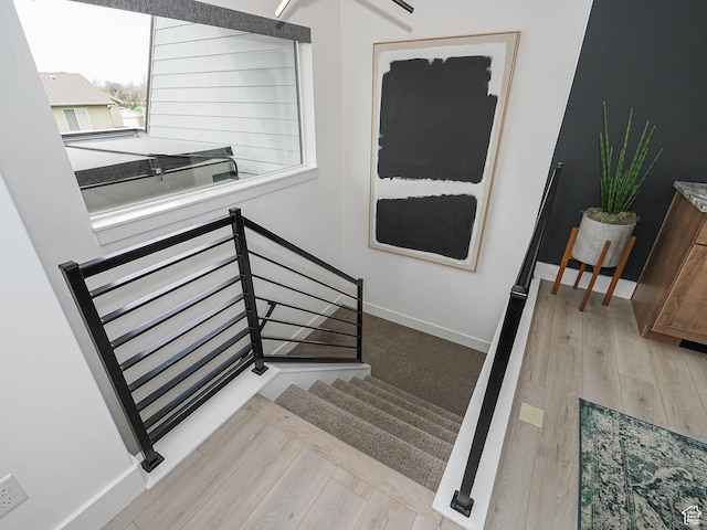 4535 S Bleecker Pl, Millcreek, UT 84117 - stairway with wood finished floors and baseboards