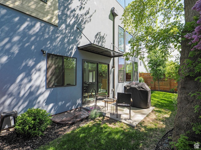 4535 S Bleecker Pl, Millcreek, UT 84117 - back of property with a patio and stucco siding