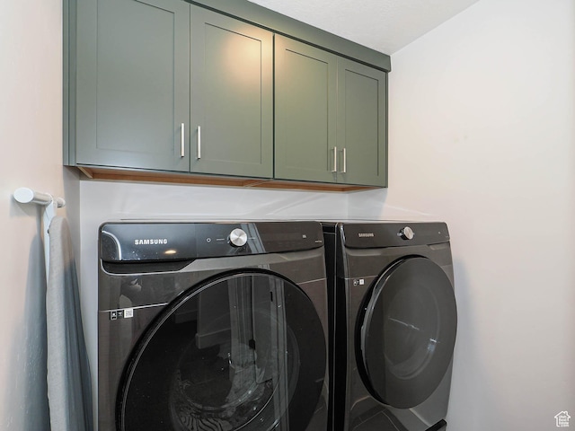 4535 S Bleecker Pl, Millcreek, UT 84117 - washroom featuring washing machine and clothes dryer and cabinet space