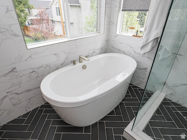4535 S Bleecker Pl, Millcreek, UT 84117 - full bath featuring tile walls and a freestanding tub