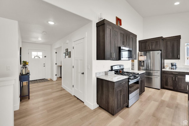 1279 S 50 E, Salem, UT 84653 - kitchen with stainless steel appliances, light wood-style flooring, dark brown cabinets, recessed lighting, and light stone counters